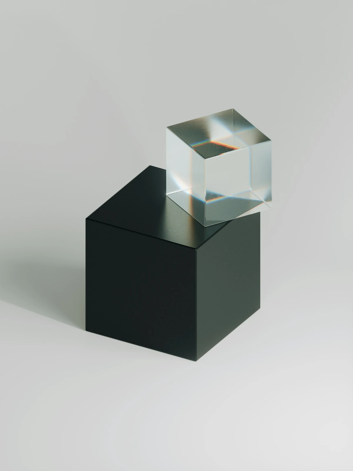 Glass cube on a dark pedestal